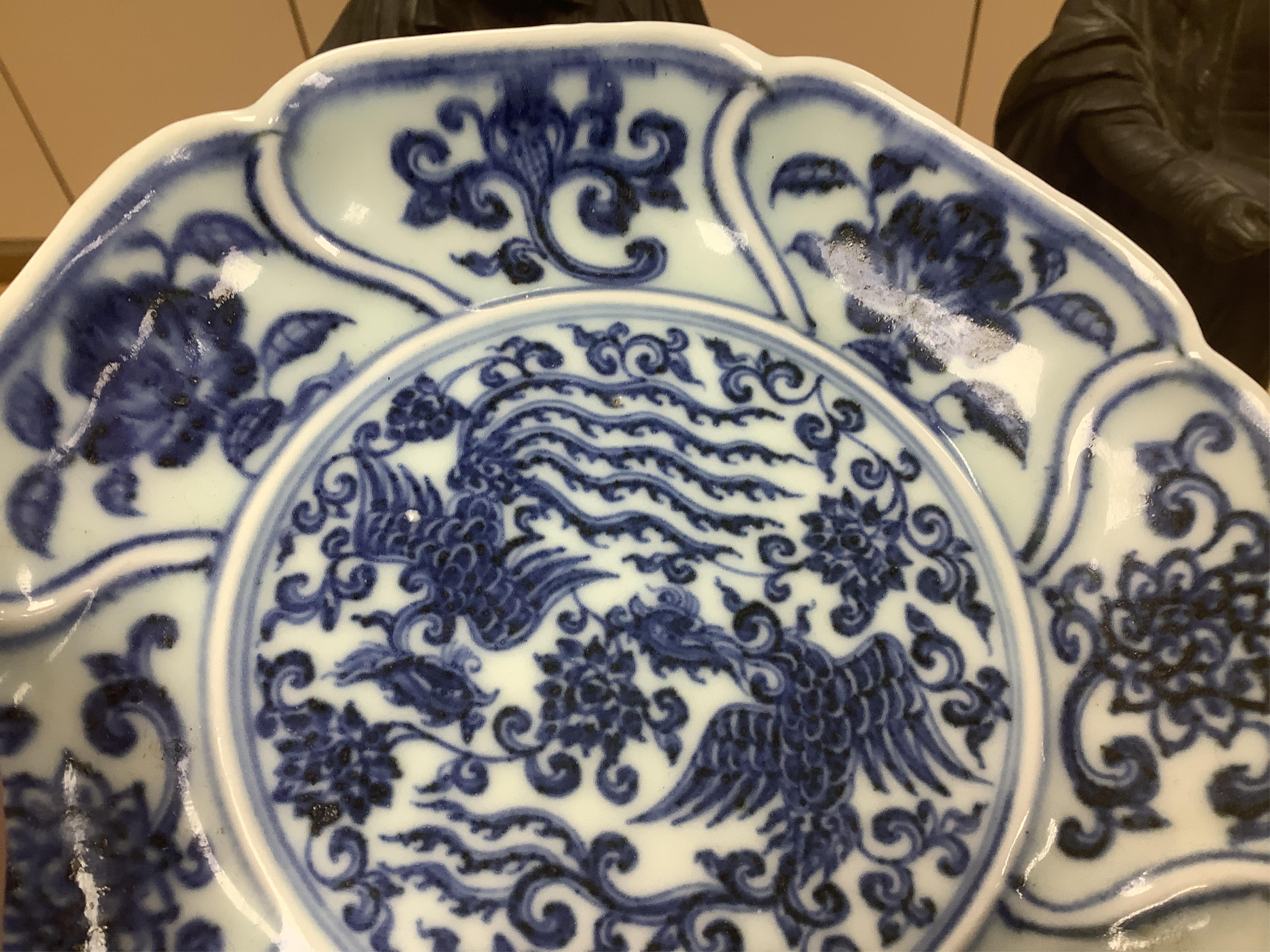 A Chinese copper red glazed dish, a blue and white bowl and a similar dish, bowl 22.5cm diameter. Condition - good